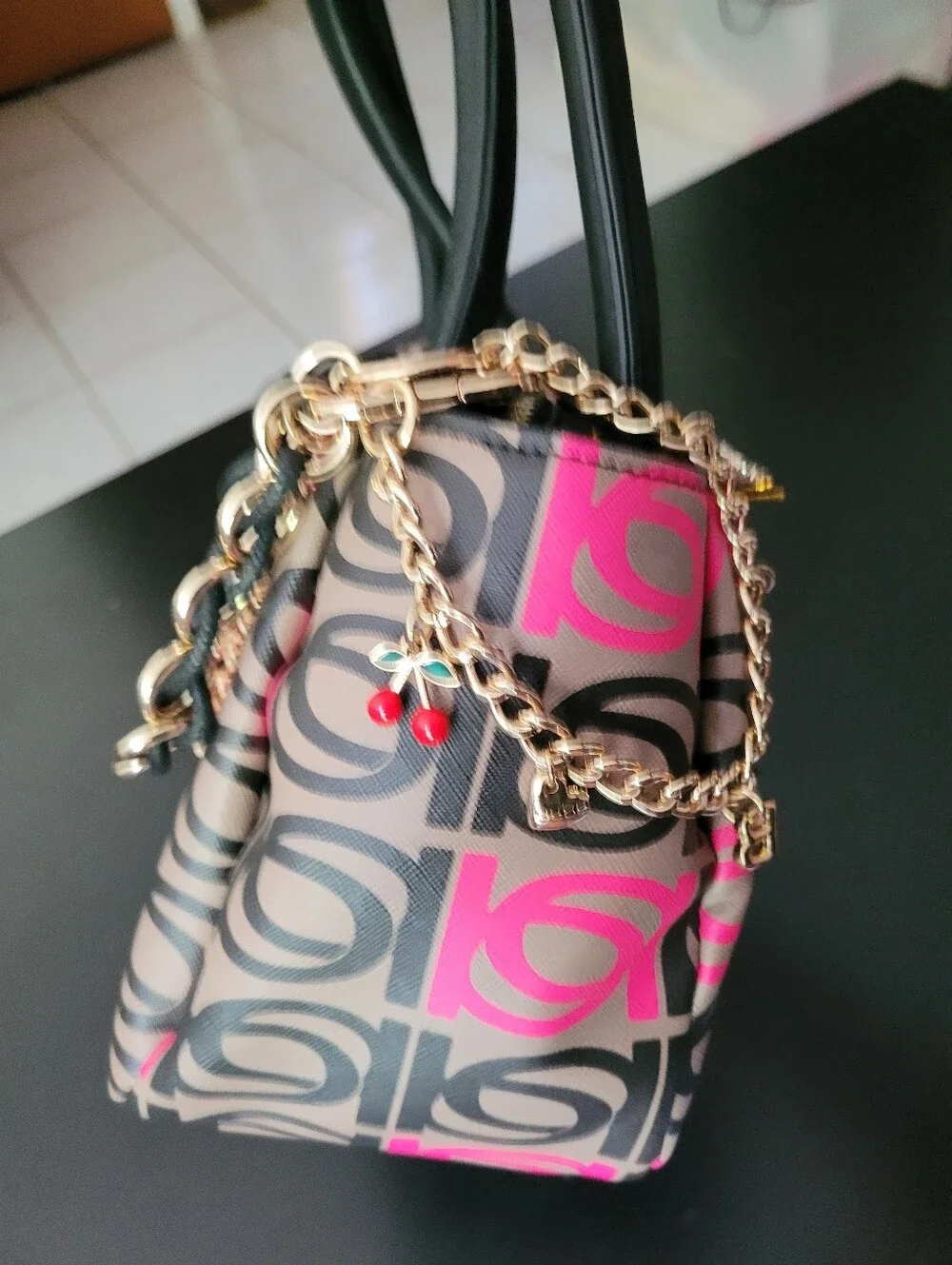 Bebe Women’s Patterned Top-Handle Bag in Black and Pink